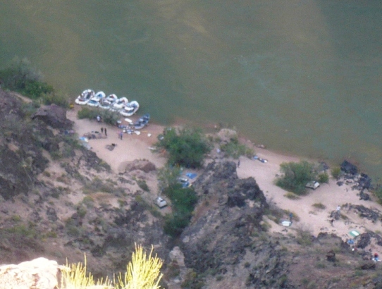 Mile 32.5, 4:49 p.m. - Down below a rafting company preparing camp for the night downriver from Hermit Rapids.  I am about 700 feet above.