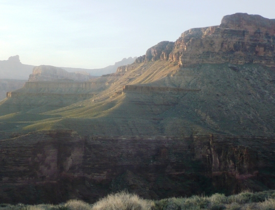 Mile 68, 6:17 a.m. - Looking across the deep gorge of Grapevine Canyon.  I would be running above those cliffs in an hour or so